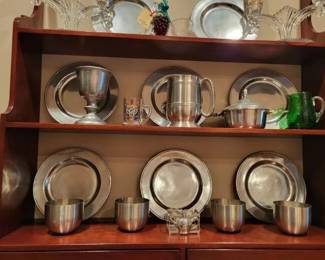 Wall mounted display shelves and silver serving ware
