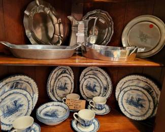 Antique dishware and silver service pieces