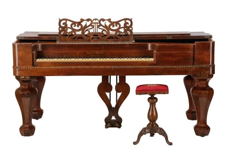 Rare Antique Dubois & Warriner (American (New York)1850-1852) Grand Piano (circa 1850-1852). An American rare and museum-quality square grand piano in rosewood having hinged top and fancy pierced music stand over a D-end molded case enhanced with ripple molding and resting on massive faceted octagonal faceted baluster form legs ending in casters. The interior above the 78 keys stamped in gilt "Dubois & Warriner New York" . The sound board is also decorated with inlaid mother of pearl. Piano is accompanied by an adjusting piano stool. Approximate height 36.5", width 73.25", depth 33.75". Note: William Dubois pianos are considered museum-quality and was one of the most renowned names in the piano industry in 19th Century. Dubois began his career as importer, retailer and music publisher in 1813 in New York City. From 1850 to 1852, Dubois partnered with Daniel C. Warriner to make pianos. Approx. Dimensions: 36.5" H x 73.25" W x 33.75" D Medium: Rosewood Date: 1850-2