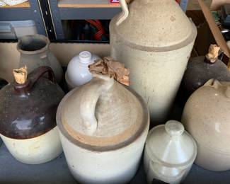 Antique crocks, chicken feeder, jugs