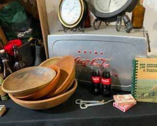 Coca Cola collectibles, wooden dough bowls, cookbooks, games