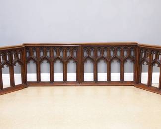 A 19th century Gothic Revival Period carved Oak altar railing.  Three sections with Gothic arches and molded railings.  Older finish with minor wear, some modifications.  Two sections 36 1/2 x 27 1/2" high, one section 73 x 27 1/2" high.