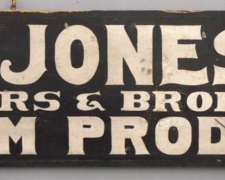 A turn of the century wooden Trade Sign advertising "W. R. Jones & Co., Dealers & Producers in Farm Produce".   Double sided painted wooden sign with Black lettering on a White background.  Some surface wear, one side worse than the other, edge damage.  39 1/2" long x 17 1/2" high overall.