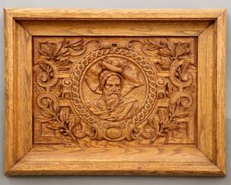 A 19th century Renaissance Revival Period carved Oak panel.  Central carved portrait medallion of a Knight within a scrolled foliate and berry border.  Older finish with minor wear.  Panel 20 3/4 x 14" high, in a molded Oak frame, 27 3/4 x 20 3/4" high overall.