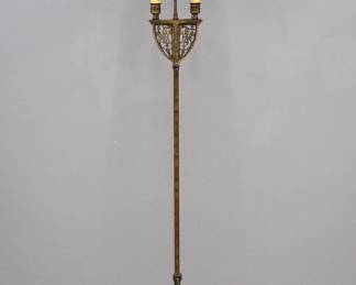 An early 20th century Gothic Revival Period floor lamp.  Cast Iron construction with two lights and Mica shade with cast metal decoration over a pierced top with Bird design, twisted stem and circular cast foot.  Cast "1586 MSL" at underside.  Wear to finish and shade.  71" high.