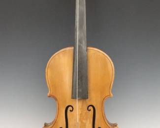 A late 19th century American Folk Art violin with carved head.  Softwood instrument with a carved figural top depicting a man's head with polychrome detail.  Instrument with wear and losses.  25 1/2" long, in a hard shell case with wear, 31" long.