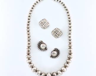 Three pieces of vintage Mexican Sterling Silver jewelry.  Includes a  graduated bead necklace with engraved decoration, and two pairs of earrings with geometric designs.  Necklace unmarked, tested Sterling, earrings marked "Mexico 925" and "Mexico Sterling".  4.92 troy ozs total.  Minor surface wear and denting.  Necklace is 24" long open, earrings are up to 1 1/2" high.