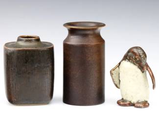 Three early to mid 20th century Scandanavian Art Pottery pieces.  Includes a Triller Tobo cylindrical vase with mottled Brown glaze, a Valdemeer Peterson for Bing & Grondahl rectangular vase with mottled Green/Brown glaze, and a Hugo Liisberg Penguin figure with multi-color glaze.  Signed "Triller Tobo", initialed "VP" with "B&G" stamp, and initialed "HL" at undersides.  Minor wear.  Up to 5 1/2" high.