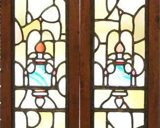 A pair of 19th century British Victorian Period stained glass windows.  Multi-color stained and leaded glass panels with blown bullseye and textured glass accents.  Panels intact, some surface wear and scratches.  In Walnut frames, both 14 x 44" high overall.