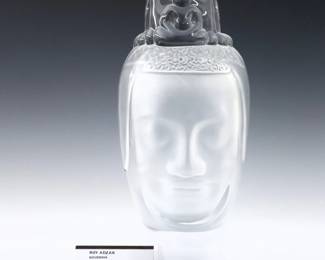 A 1970's Daum Crystal sculpture designed by Roy Adzak, titled "Bouddha".  Depicts a Buddha head with frosted detail.  Signed "Roy Adazk" at base lower left, numbered "72/300" and incised "Daum France" lower right.  Minor wear.  13 1/2" high.
