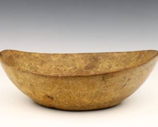 An 18th century Native American Burl Maple bowl.  Hand-carved oval form bowl with sloping rim.  Some wear and shrinkage.  15" long x 5" high overall.