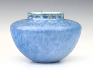 An early 20th century Roseville Art Pottery vase, c. 1930.  Shape 200, bulbous form with relief geometric decoration and mottled Blue glaze.  Retains original foil "Roseville Pottery" label at underside.  Minor crazing.  8 1/2" high.