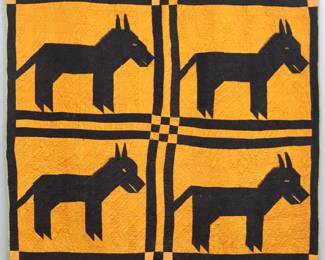 An early 20th century American Folk Art quilt, possibly African American.  Hand-stitched, pieced and quilted with Mule design in Orange and Black, with a plain Olive Green backing.  Some wear, minor fading and pulls, hanging panel attached.  68 x 72 1/2" high overall.