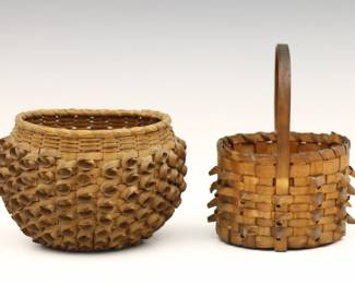 Two turn of the century Woodland Native American miniature baskets.  Wood splint and Sweetgrass construction with Porcupine Twist decoration, one with strap handle.  Minor discoloration and damage to some of the twists.  Up to 5" long and 5" high.