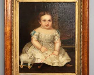 A 19th century American oil on canvas portrait of a young girl.  Depicted seated in a Victorian parlor wearing a White dress and holding a pull toy sheep with an obscured landscape beyond an open window.  Unsigned.  Craquelure, some previous restorations with patches to canvas back, a few small flakes and scratches to paint.  Image 23 1/2 x 29 1/2" high, in a Birdseye Maple frame with some wear, 34 1/4 x 40 1/4" high overall.