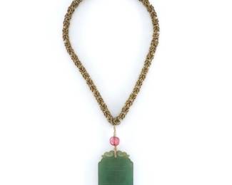 A turn of the century Chinese Green Jade pendant necklace.  Pierced Jade pendant with carved characters suspended from a coiled Gold Filled Byzantine style chain with Pink Tourmaline stone and seed Pearl accents.  Minor surface wear, chain lacks part of clasp.  Pendant is 2" high, necklace is 15 1/2" long open.