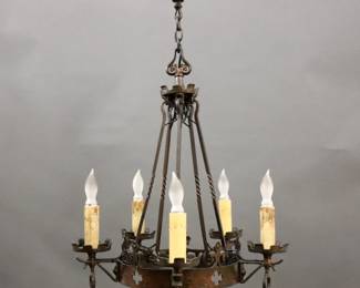 An early 20th century Gothic Revival Period chandelier.  Five light design with patinated Brass body and pierced Cross detail.  Some wear to finish and "candles".  Approx. 20" diameter x 24" high overall.
