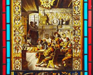 A late 19th century German stained glass window panel by Carl Ludwig Turke and Richard Schlein, Zittau.  Multi-color stained and leaded glass panels with a reverse painted tavern scene within a Gothic style border and lower allegorical frieze depicting young friars and The Arts.  Signed "Turke & Schlein, Zittau" for Royal Court Glass Painting & Art Glassworks Turcke & Schlein.  One border panel cracked, minor wear to paint.  16 x 21 1/2" high overall.