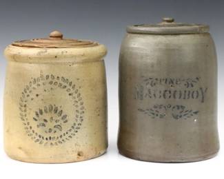 Two 19th century American covered Stoneware crocks.  Tapered forms with faded Cobalt stenciled decoration, taller a "Fine Maccoboy" snuff crock.  Both with wear and minor edge damage.  Up to 9 1/4" high.
