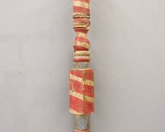 A painted Barber pole fashioned from 19th century rope bed post.  Worn painted finish in Red, White and Blue.  Paint wear, modern wooden wall holder.  42" high overall.