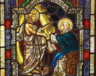 A Gothic Revival stained glass window of The Resurrection.  Multi-color stained and leaded glass panels with reverse painted detail depicting a radiant Resurrected Christ appearing to his mother the Virgin Mary within geometric and foliate borders.  One cracked panel at border, touch up to enameled border, some wear to paint.  In a later Oak frame, 22 1/2 x 33 3/4" high overall.  ESTIMATE