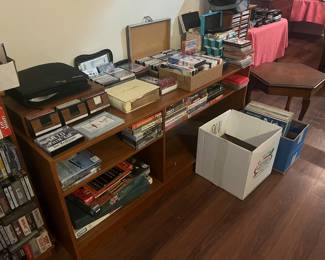 A Couple of boxes full of record albums, plus 45s, Cassettes, VHS tapes, DVDs, etc.