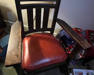 Primitive Rocking Chair with pleather cushion.  Sits nicely.  Very sturdy.