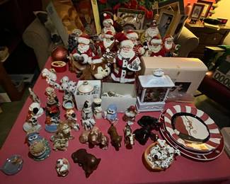 Assortment of salt & pepper shakers, plates, and other collectibles.
