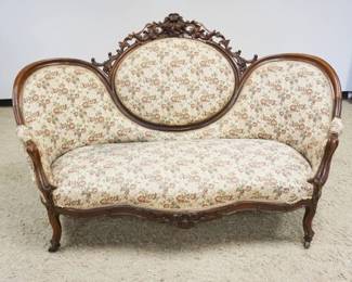 1172	WALNUT VICTORIAN MEDALION BACK UPHOLSTERED SOFA W/HEAVILY CARVED CREST, APPROXIMATELY 71 IN X 44 IN HIGH, STAINING ON UPHOLSTERY
