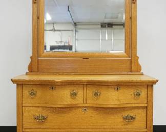 1203	VICTORIAN OAK 4 DRAWER CHEST W/BEVELED MIRROR TOP, APPROXIMATELY 45 IN X 21 IN X 77 IN HIGH
