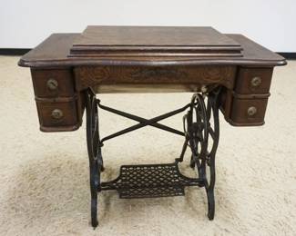 1187	UNIQUE OAK TREADLE SEWING MACHINE, APPROXIMATELY 34 IN X 18 IN X 31 IN

