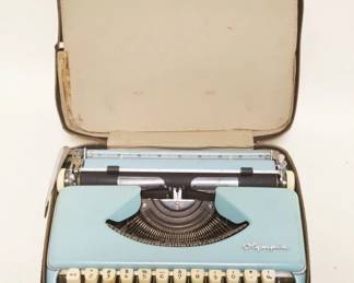 1306	OLYMPIA TYPEWRITER, APPROXIMATELY 12 IN X 13 IN X 4 IN
