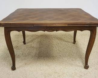 1168	FRENCH PROVINCIAL OAK PARQUET TOP TABLE W/PULL OUT LEAVES, APPROXIMATELY OPEN 78 IN X 36 IN X 29 IN, CLOSED 47 IN
