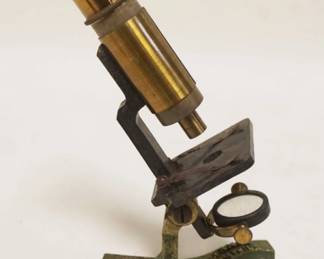 1094	ANTIQUE MINIATURE BRASS MICROSCOPE *UNIVERSAL MICROSCOPE*, APPROXIMATELY 8 IN HIGH
