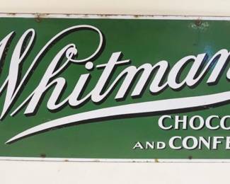 1017	ANTIQUE LARGE ENAMEL SIGN WHITMAN'S CHOCOLATES & CONFECTIONS, HEAVY GAUGE, APPROXIMATELY 39 1/2 IN X 13 1/ IN
