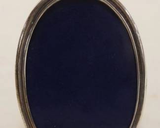 1065	CARTIER STERLING OVAL FRAME, APPROXIMATELY 4 IN HIGH
