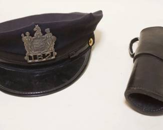 1245	ANTIQUE POLICE HAT W/EMBLEM & LEATHER HOLSTER
