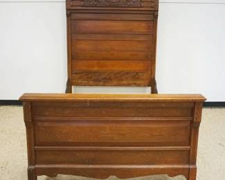 1198	ANTIQUE OAK BED W/CARVED CREST HEADBOARD, APRROXIMATELY 54 IN INNER X 75 IN HIGH
