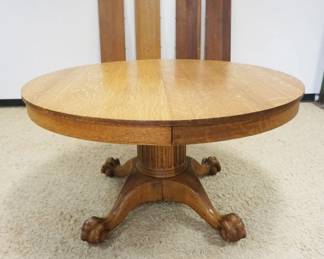 1179	54 INCH SOLID ROUND OAK TABLE W/FLUTED COLUMN & BALL & CLAW FEET, 4-11 INCH LEAVES
