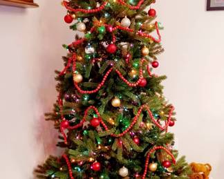 8 ft PRE LIT CHRISTMAS TREE AND STAND. DECORATIONS INCL