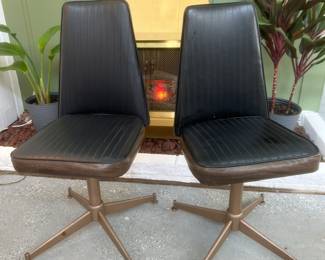 Louisville Chair Co .black and woodrgain vinyl dinette chairs. Upholstery is in great shape. Some wear on legs.