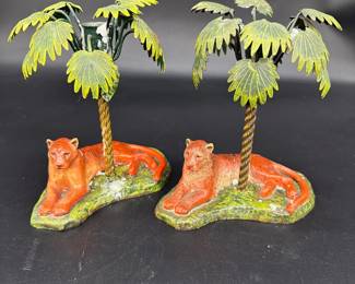 Pair ceramic lioness with metal palmtree candleholders $150