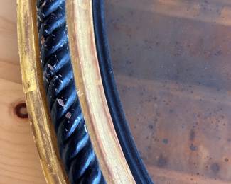 Antique black rope 41.5" mirror with giltwood, $400
