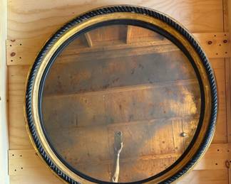 Antique black rope 41.5" mirror with giltwood, $400