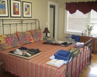 King size metal bed, linens, reversible coverlet