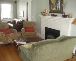 Loveseat by Retrospect (Room and Board), upholstered chairs, leather ottoman, pottery, floor lamp