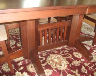 Base of dining room table, area rug