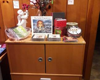 Cabinet with hanging file drawer; Christmas CDs and tins