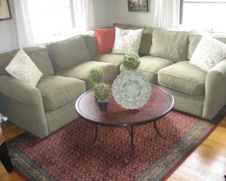 Upholstered sectional from Room and Board, painted wood coffee table, area rug