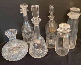 Four Decanters 1 Waterford, Two Crystal Cocktail Shaker 1 Signed Orrefors, And A Sterling Silver Scotch Bottle Charm